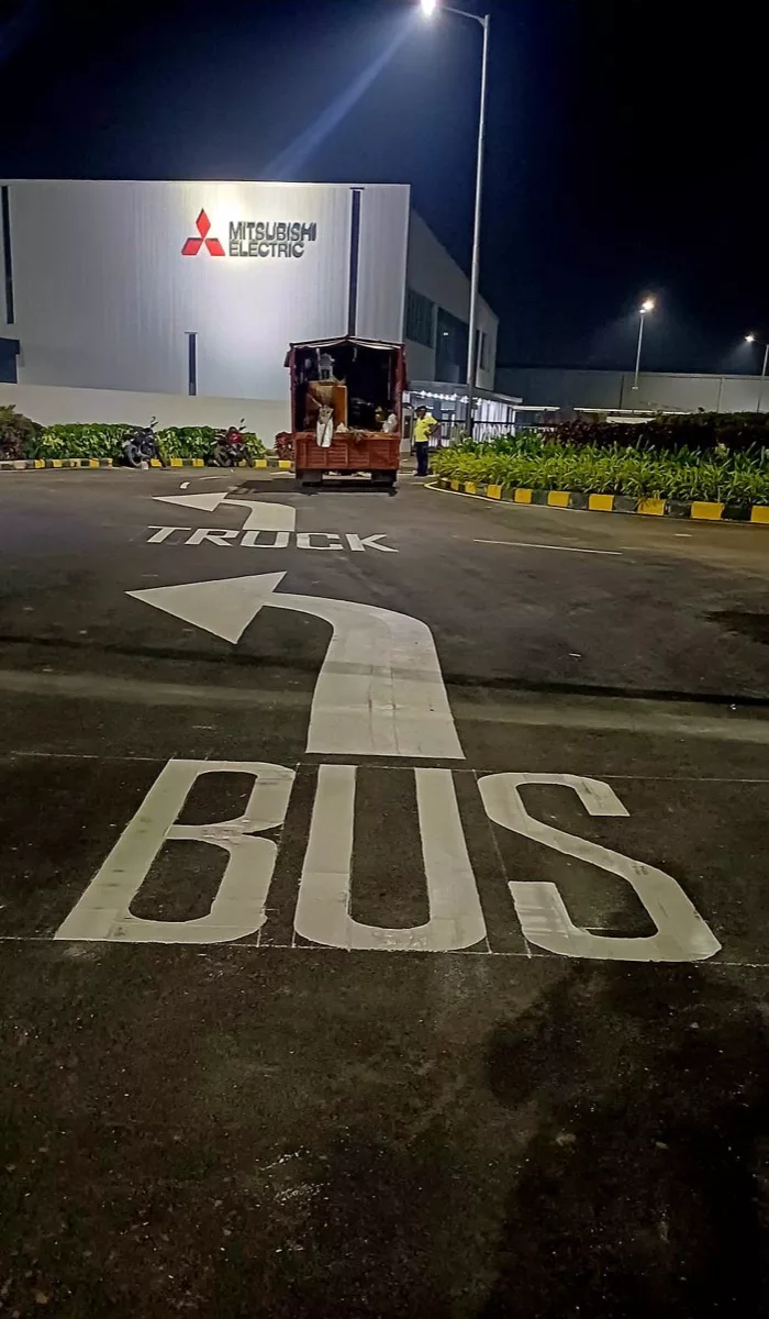 BUS directional arrow road marking at an industrial facility
