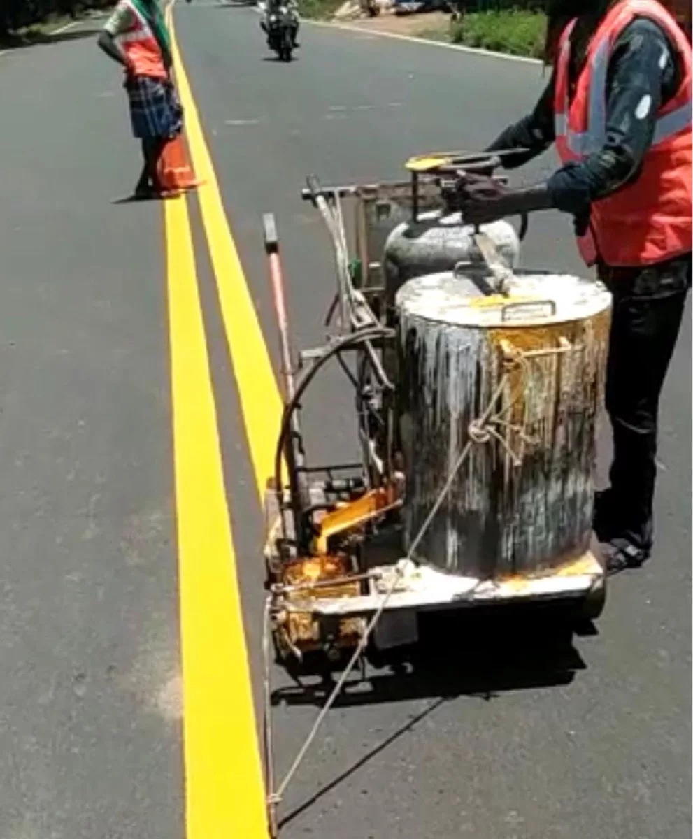 Conventional paint applicator marking a double centre line